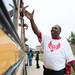 Isiah Daniel, Willow Run Middle School's intervention specialist, high-fives students on a bus before they leave Willow Run Middle School for the last time, Friday June 7.
Courtney Sacco I AnnArbor.com  